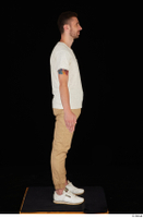  Trent brown trousers casual dressed standing white sneakers white t shirt whole body 0007.jpg